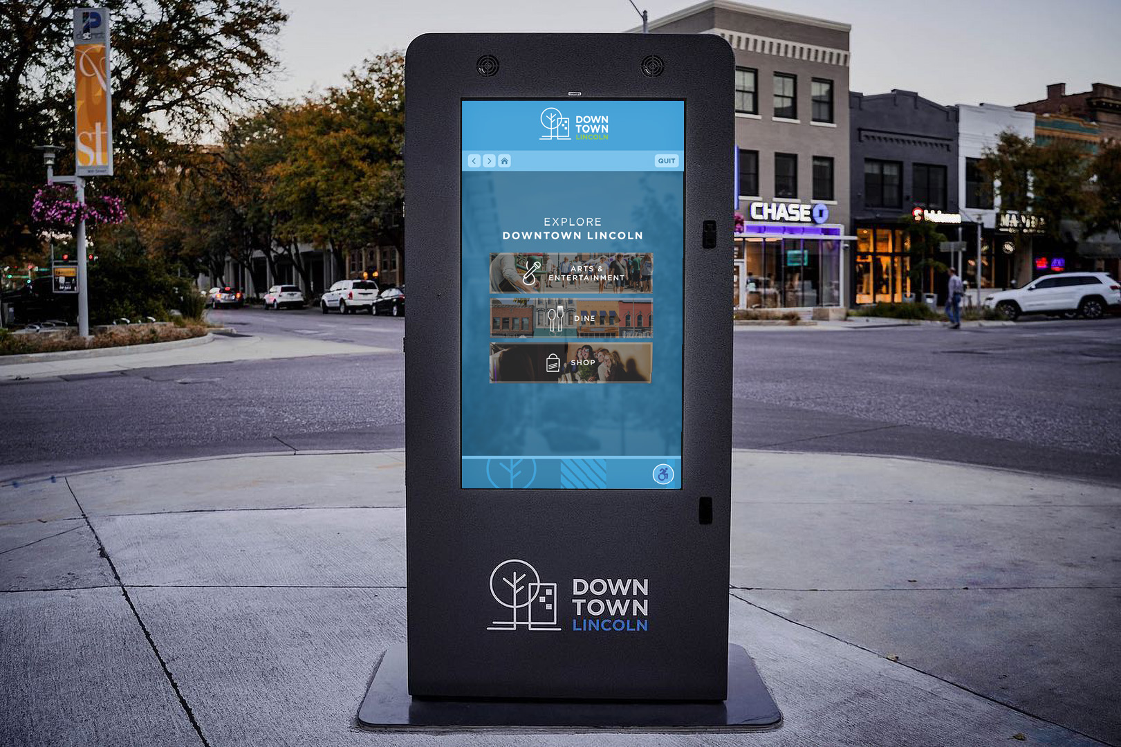 Kiosk screen in downtown Lincoln, NE showing the landing page of the directory with 3 buttons labelled Arts & Entertainment, Dine, and Shop. 