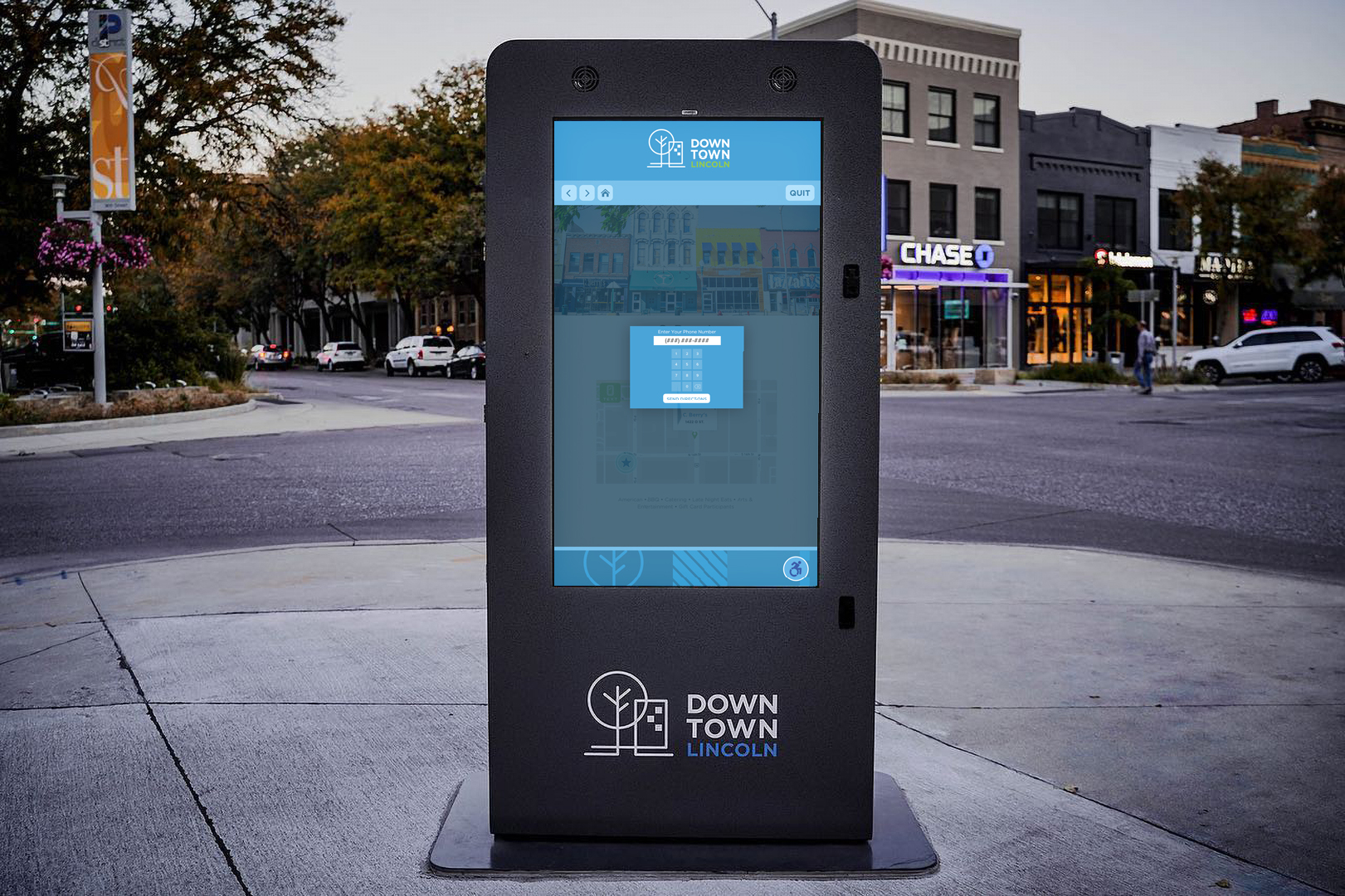 Kiosk screen in downtown Lincoln, NE showing a pop up to input a phone number to receive directions to one's phone.